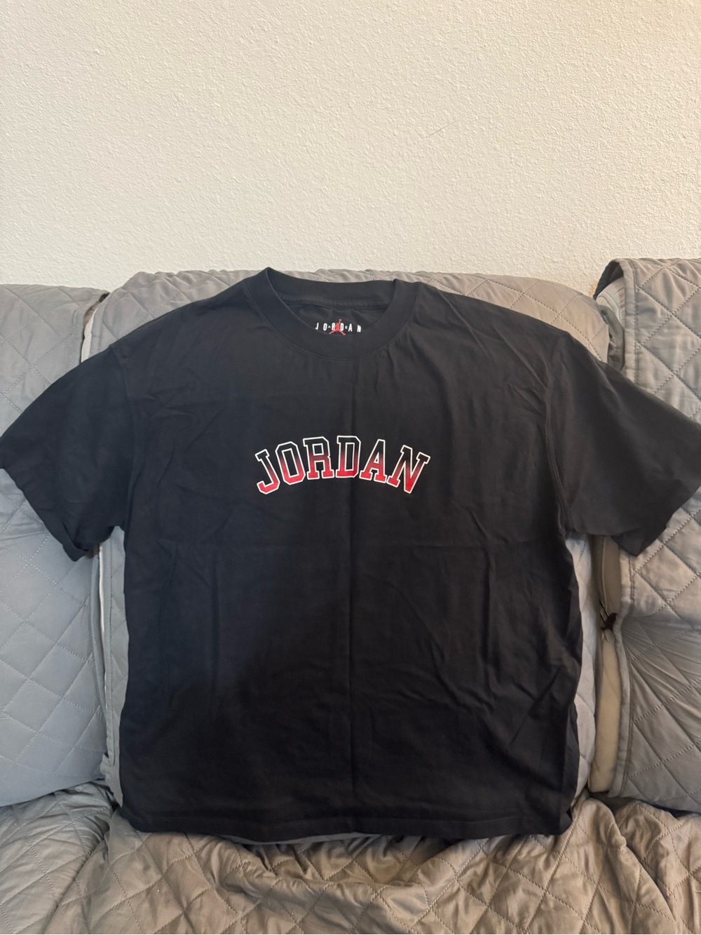 Jordan Black Tee with Red and White Arch Logo
